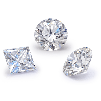 Loose lab grown diamonds of varying shapes including round, emerald and oval.